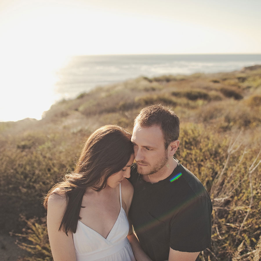 Rustic Beach Engagement: Romantic Couple Embrace