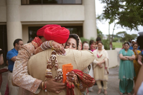 Emotional Indian Wedding Embrace: Bride, Groom, and Father's Heartfelt Moment