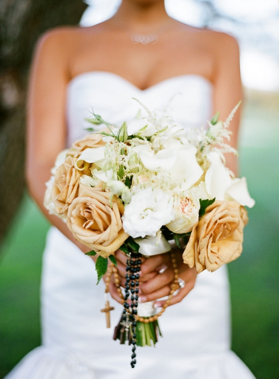 Elegant cream and white bridal bouquet with roses and rosary beads