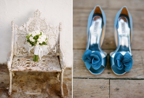 Wedding bouquet and blue shoes on a vintage bench at Villa San Juan Capistrano