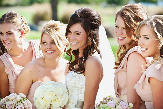 Elegant bride and bridesmaids on a sunny wedding day celebration
