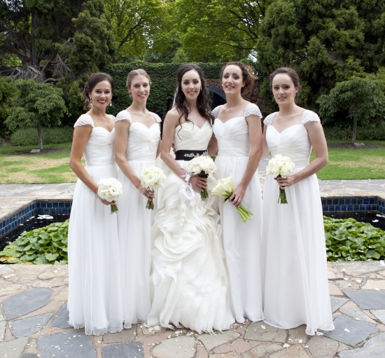 Elegant White Wedding: Bride, Bridesmaids, and a Classic Wedding Party