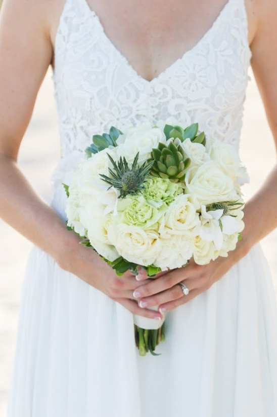Bride with white bouquet captured beautifully by Filda Konec.