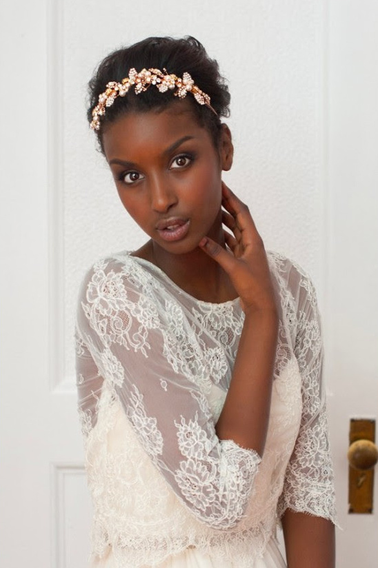 Elegant bride with floral headpiece and rose gold bridal accessories