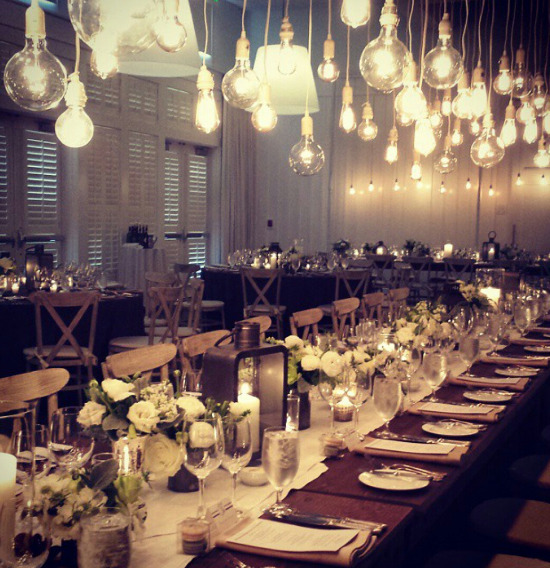 Elegant Wedding Reception: Table Setting with String Lights by Quintana Events