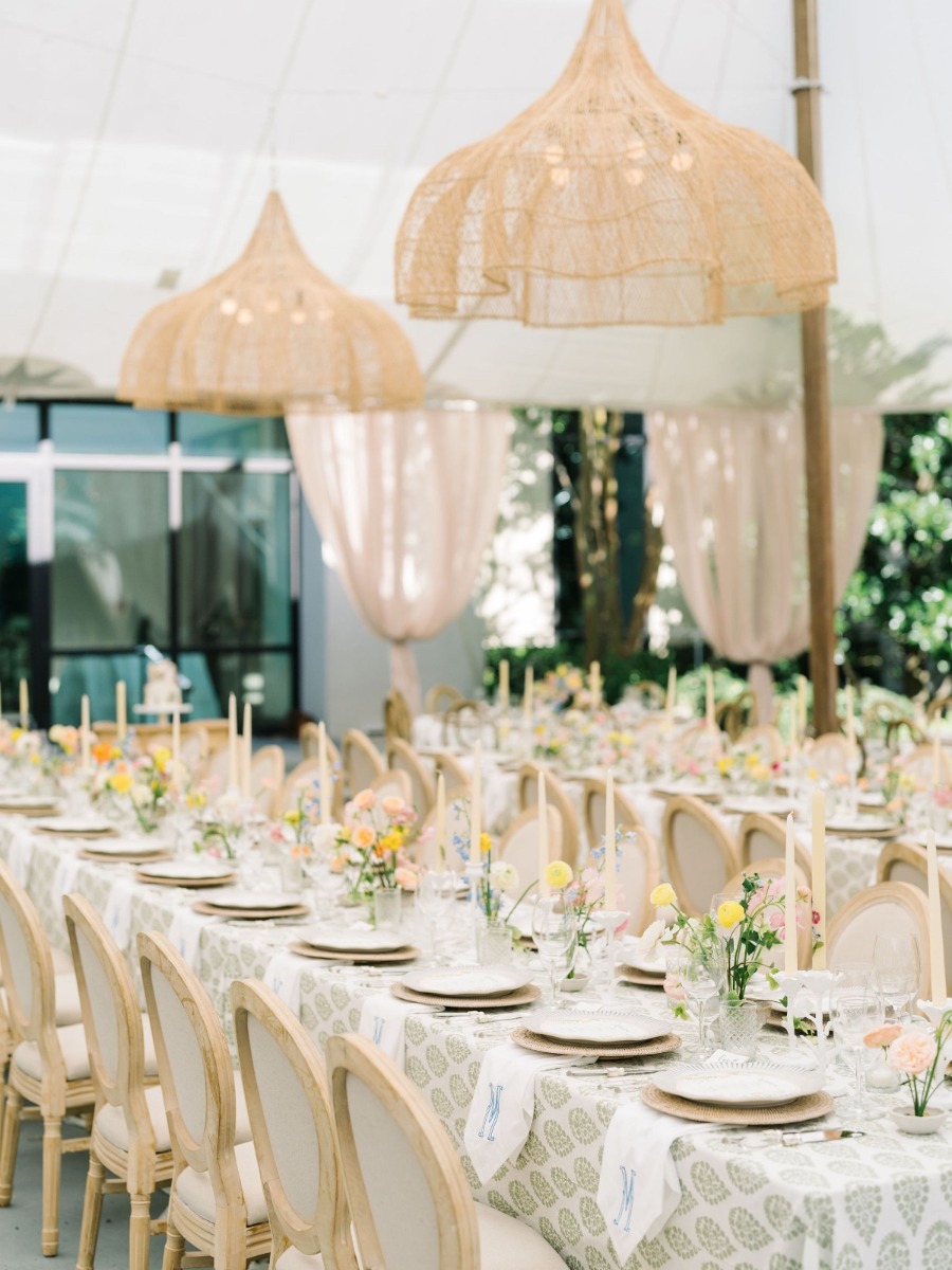 The groom's mom embroidered all the napkins for this garden wedding