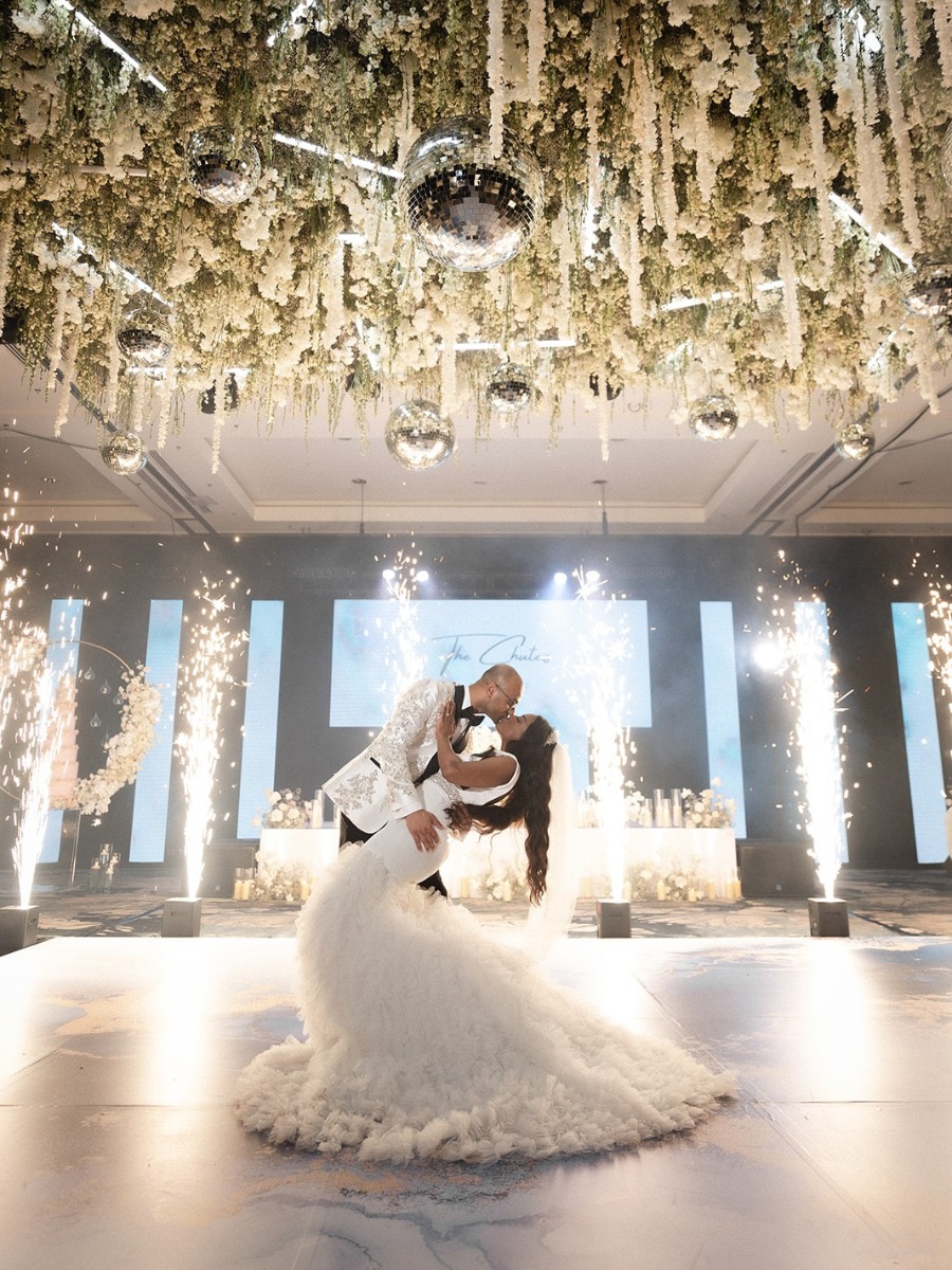 Clouds of florals didn't rain on this travel-themed resort wedding
