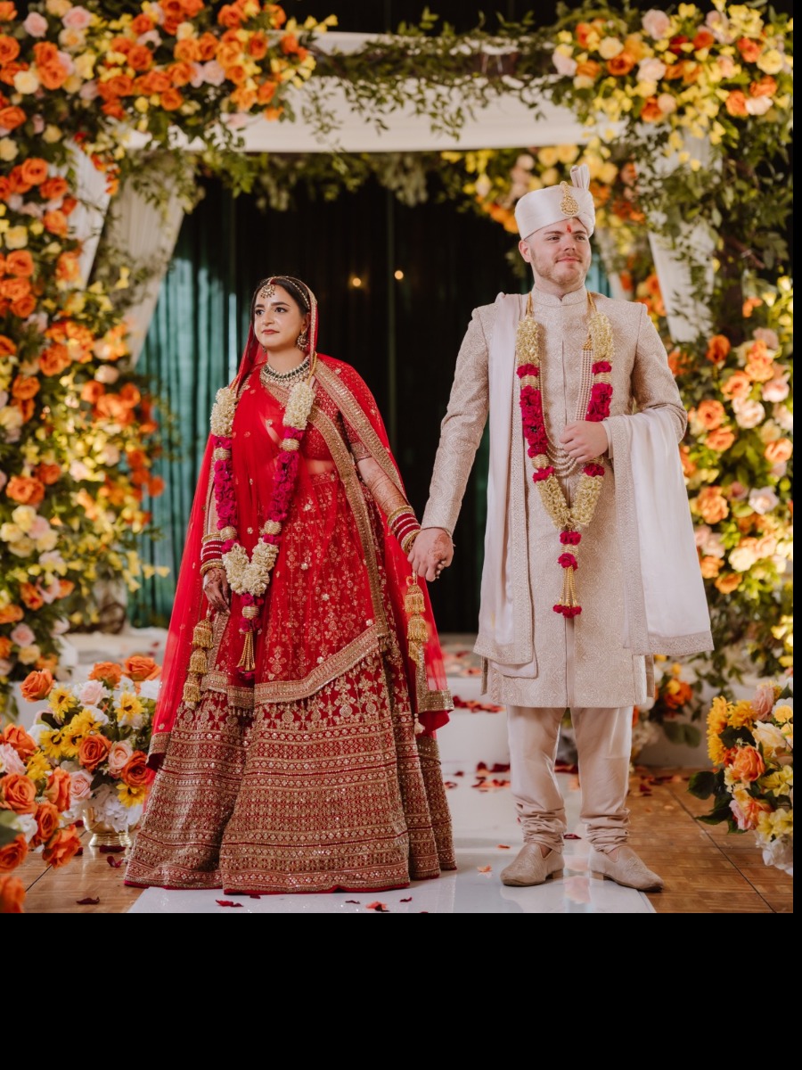 Indian wedding on the hudson in shades of red, orange, and gold