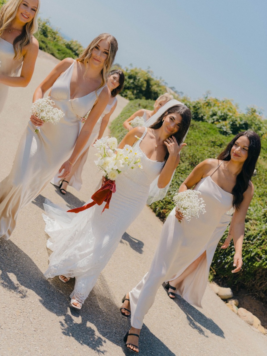 Monochromatic cliffside wedding in Santa Barbara with pop of red