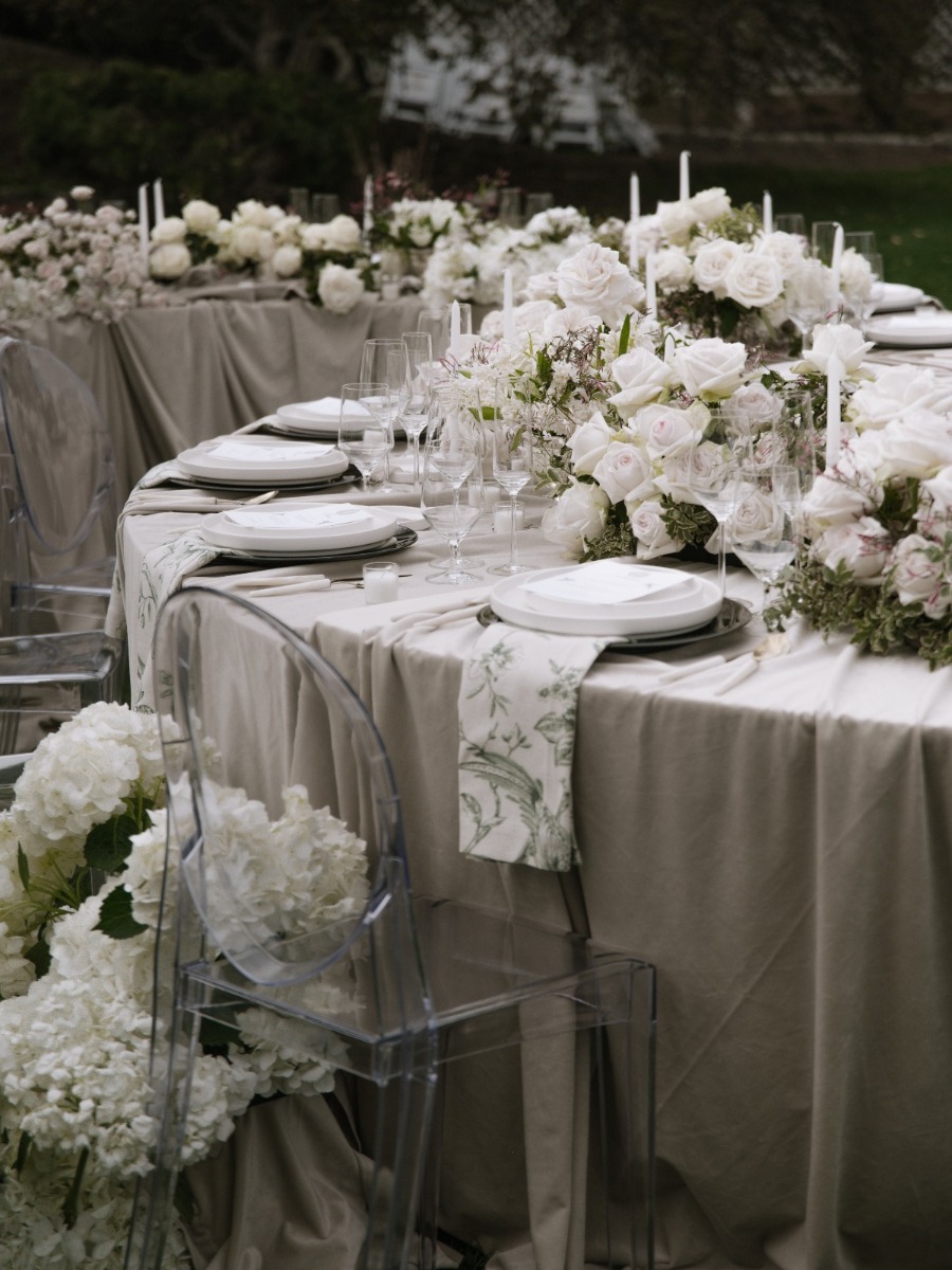 Moody monochromatic garden shoot with a dramatic draped floral arch
