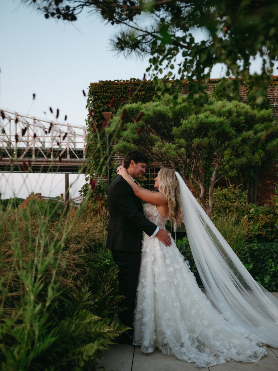 The bride wore a galia lahav ball gown to her secret garden wedding