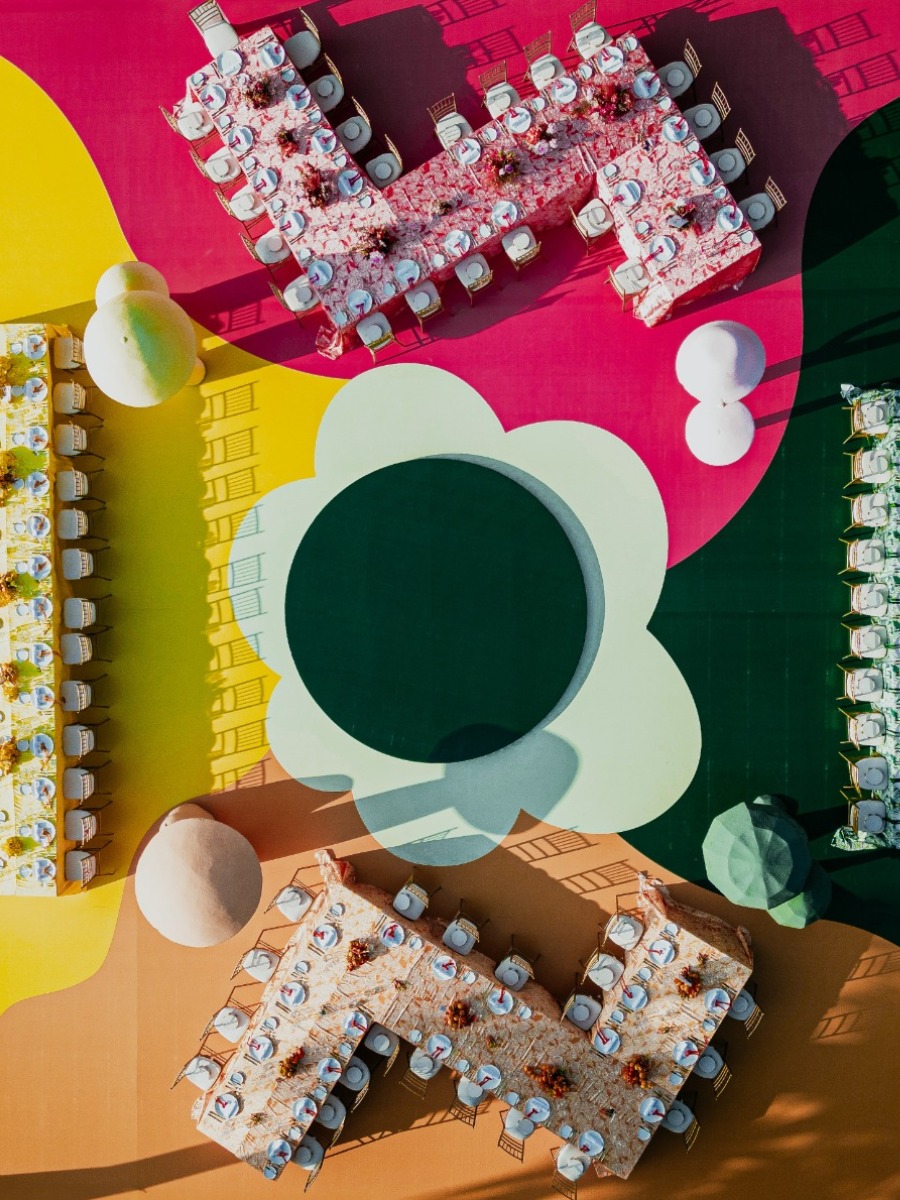 Vibrant beach wedding in vietnam with a psychedelic rainbow reception