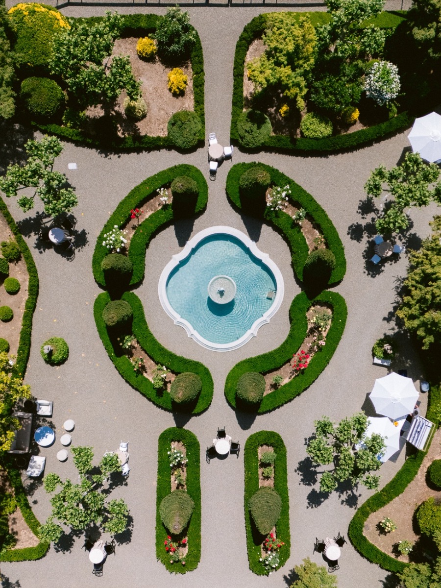 An intimate garden wedding in napa with a dramatic fountain aisle
