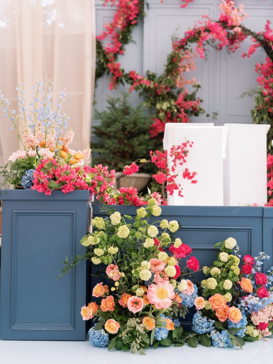 Fuchsia and blue wedding with brilliant bougainvillea installations