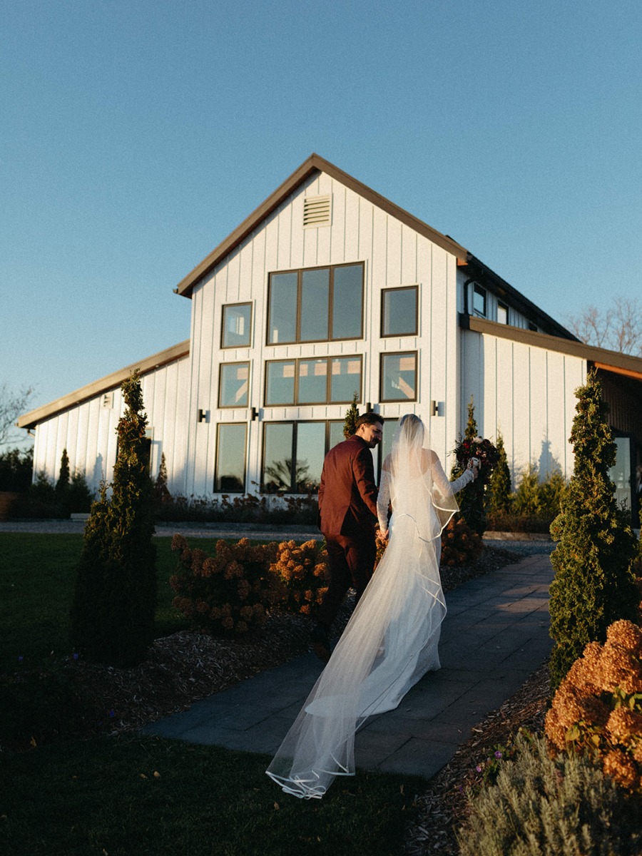 The bride planned her own black and wine fall wedding at Farmhill