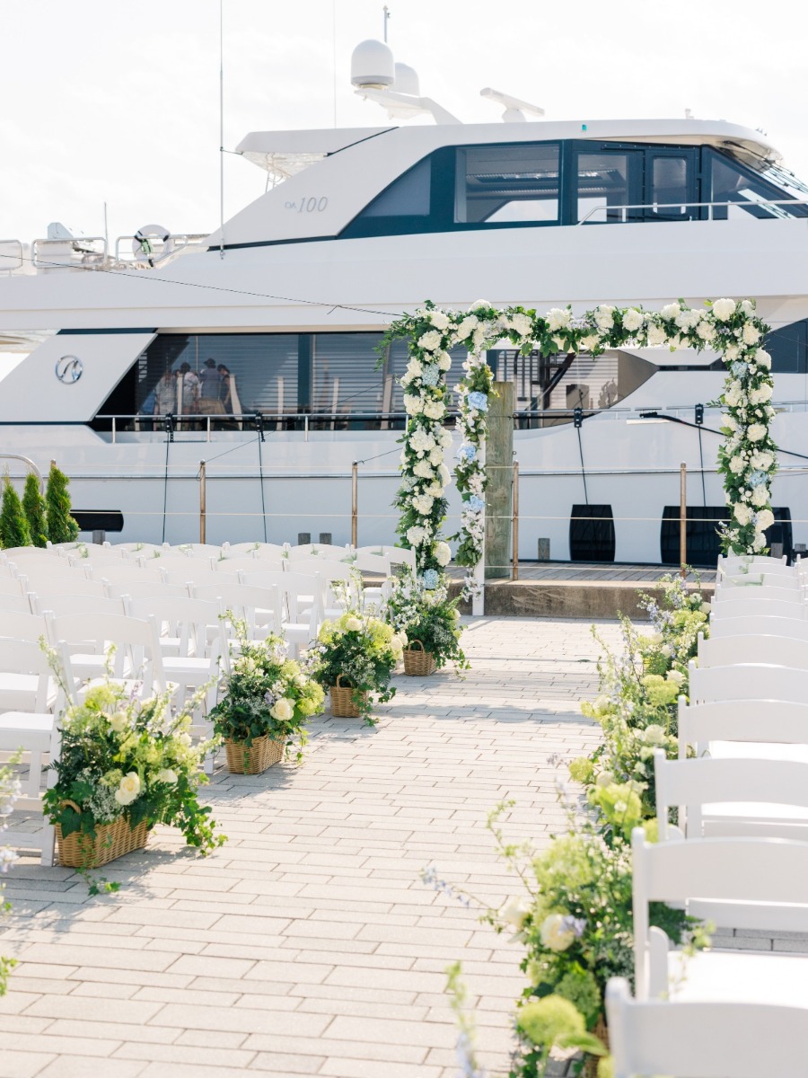 Blue & white seaside wedding in Newport with a yacht as a backdrop