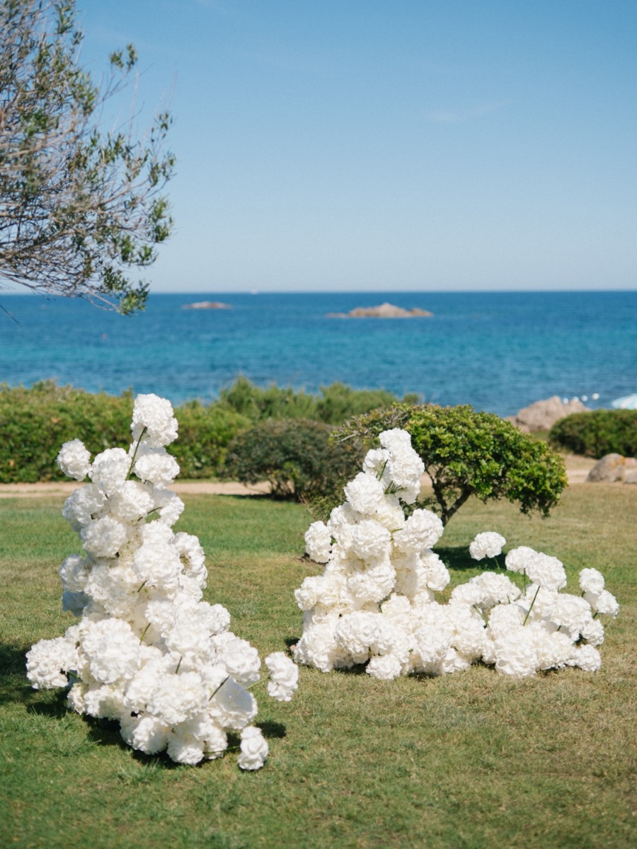 Cloud-like florals and coastal chic on the shores of sardinia