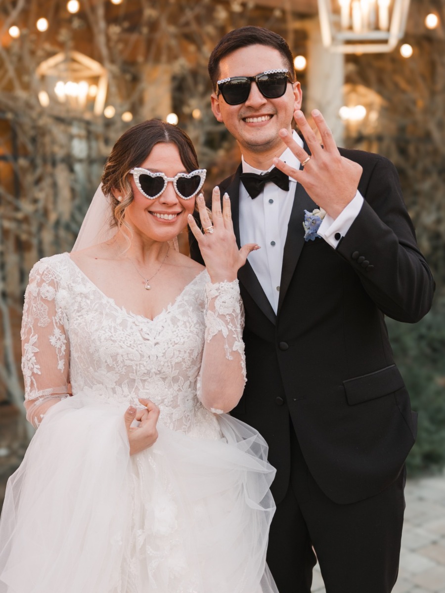Draped winter wedding under a showstopping set of chandeliers